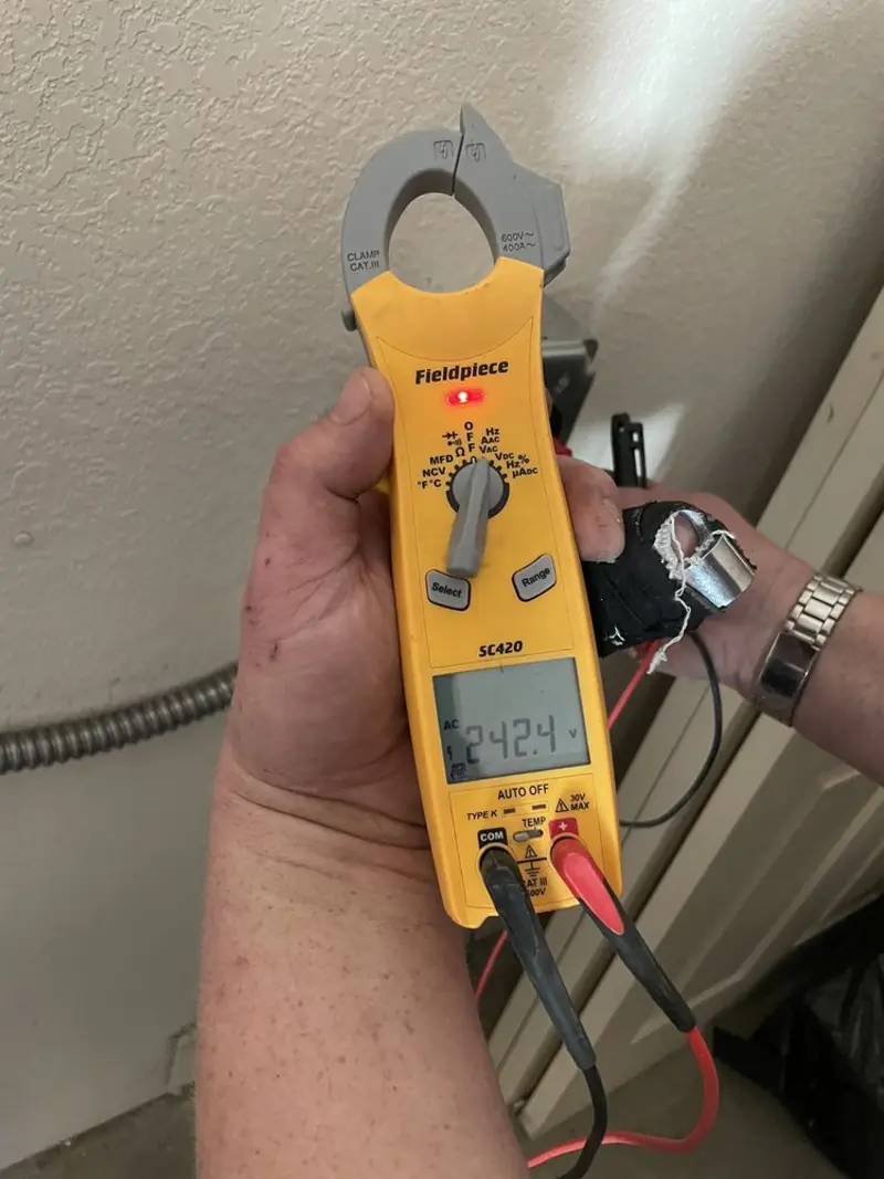 Voltage testing with clamp meter during Circuit Breaker Repair in St. Louis Park